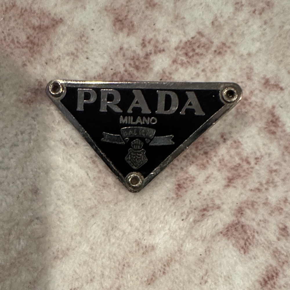 Prada Triangular Black and Silver Emblem